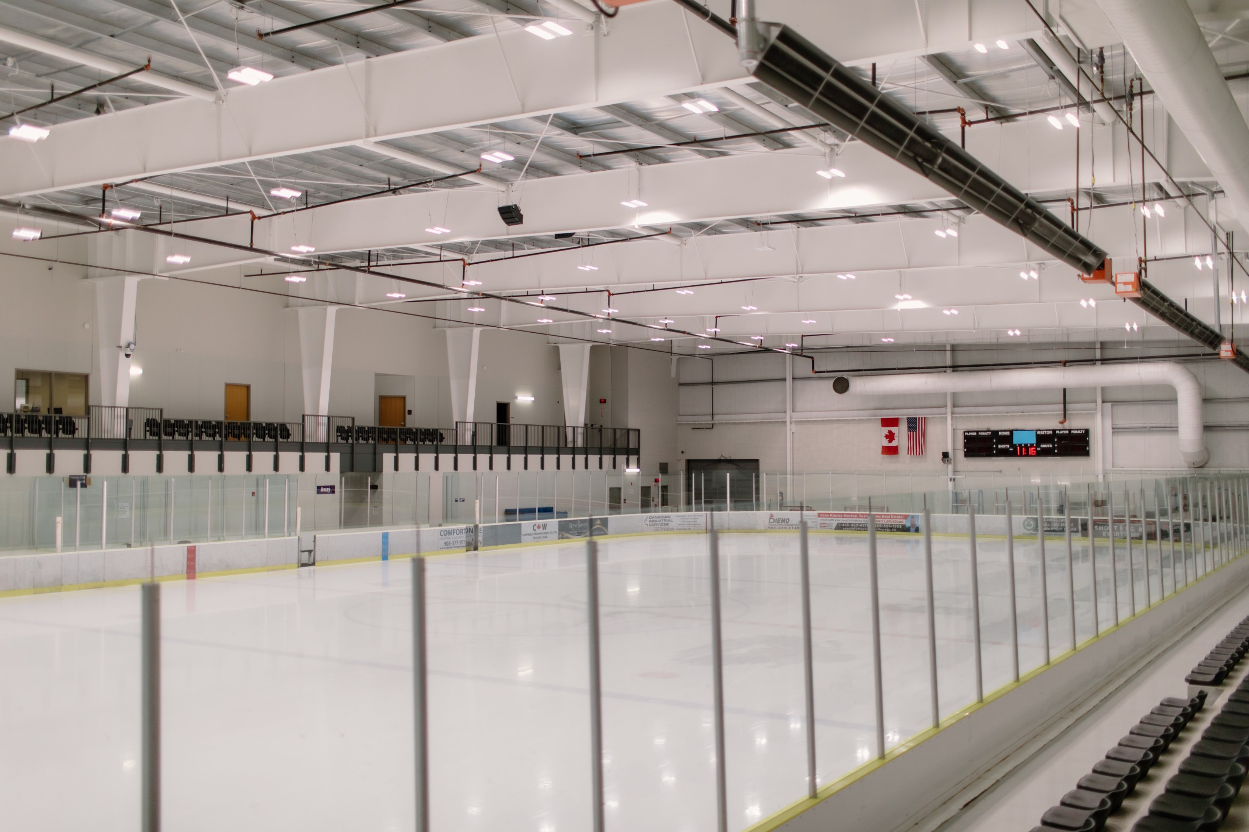 Interior shot of an empty ice rink at Grace Bowen Arena in the Cobourg Community Centre